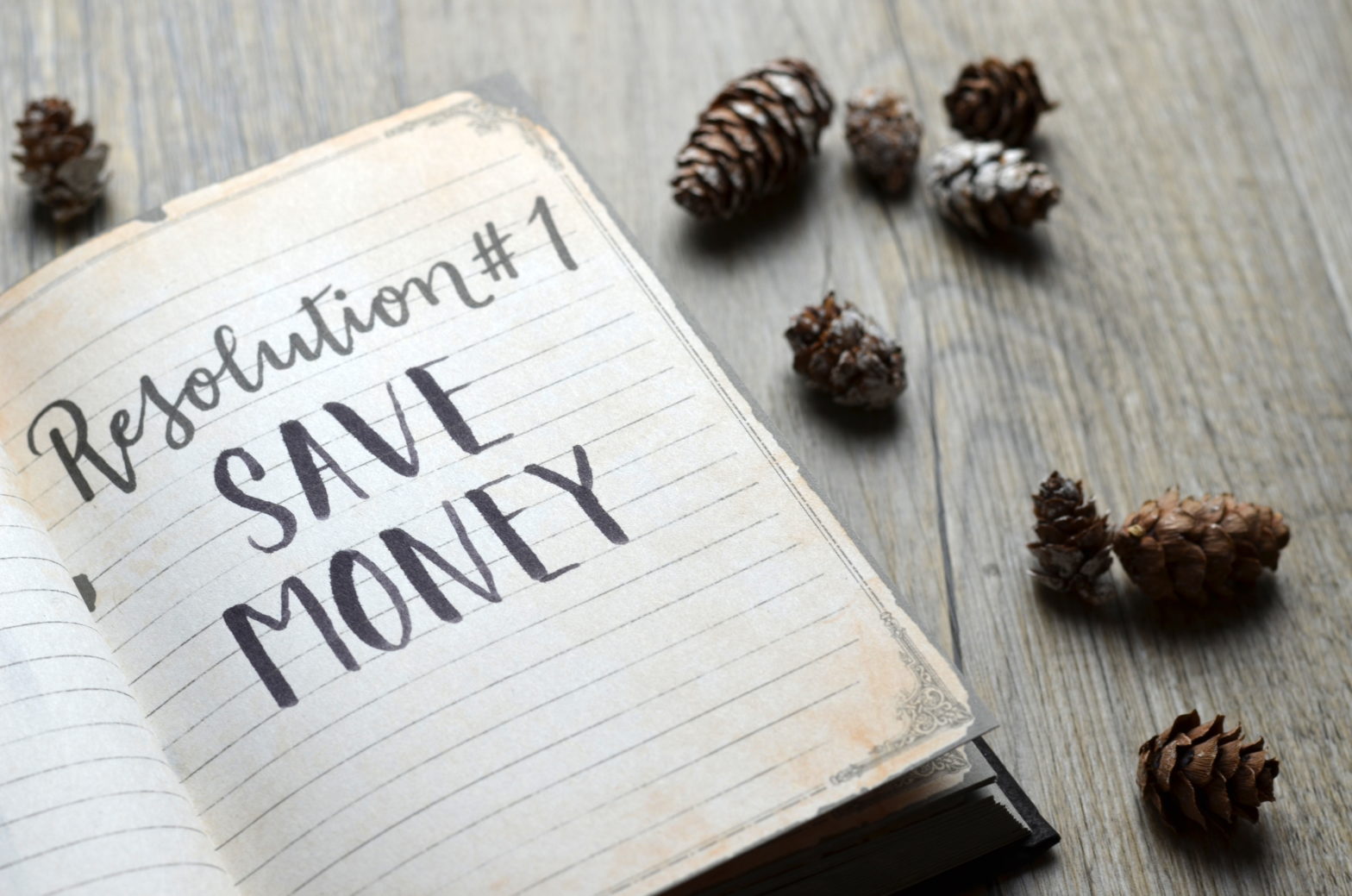 Notebook page saying "Save Money"