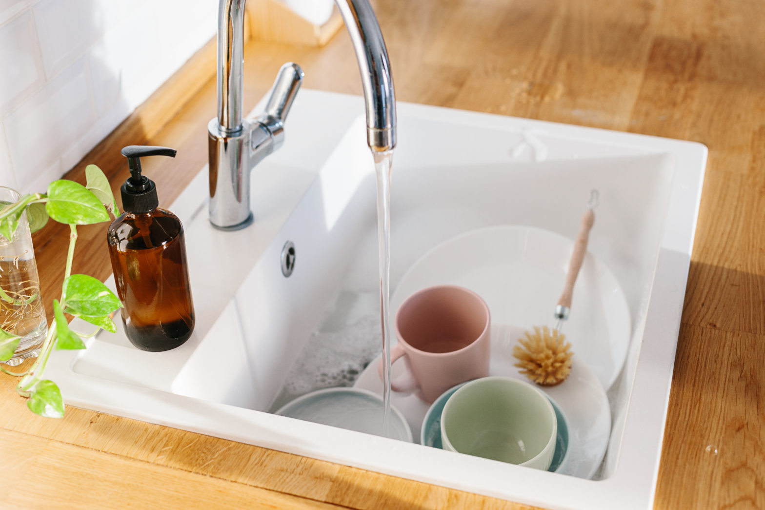 Sink with dishes and scrubber