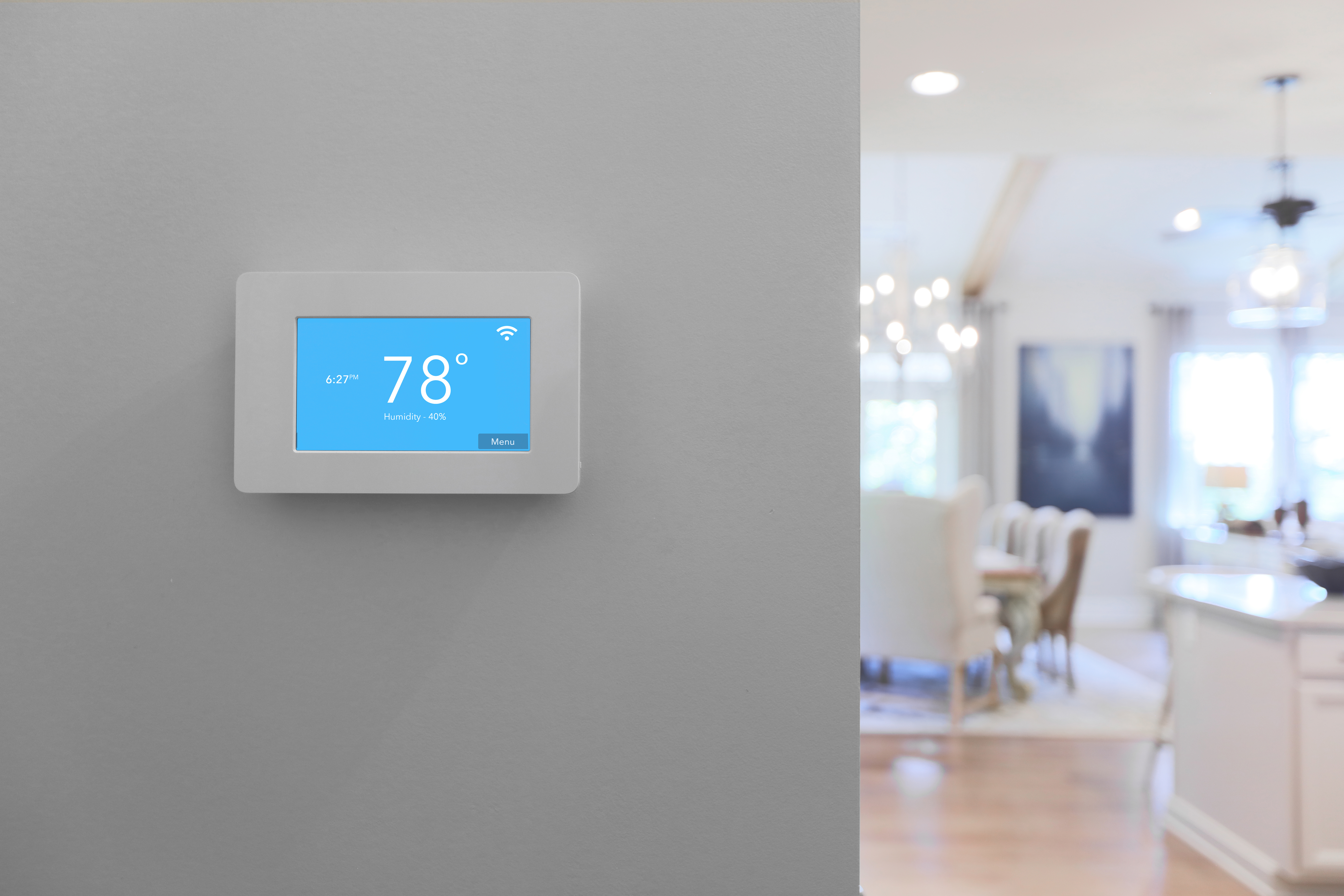 Smart thermostat on wall in elegant home