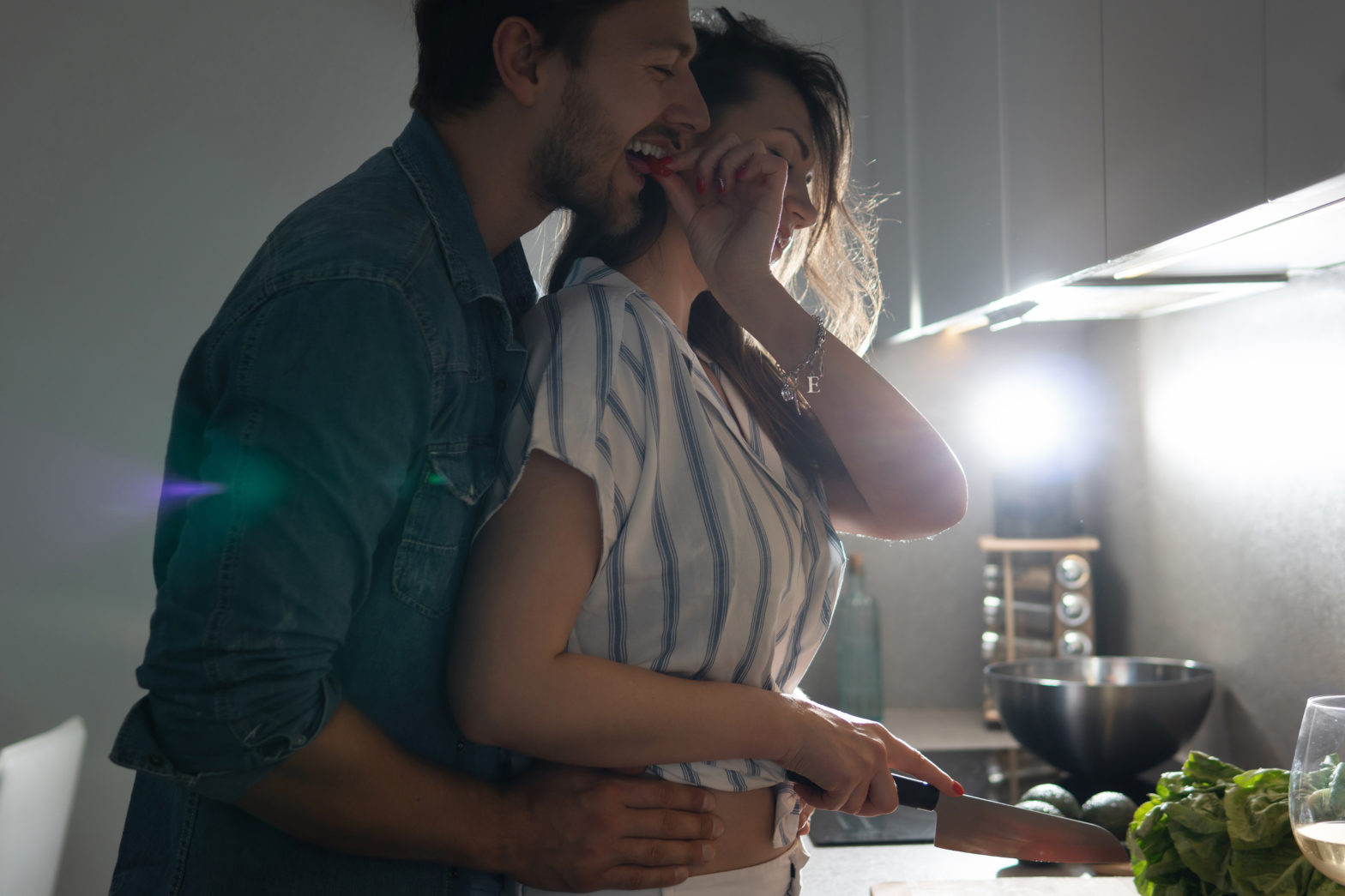 Romantic couple cooking in kitchen